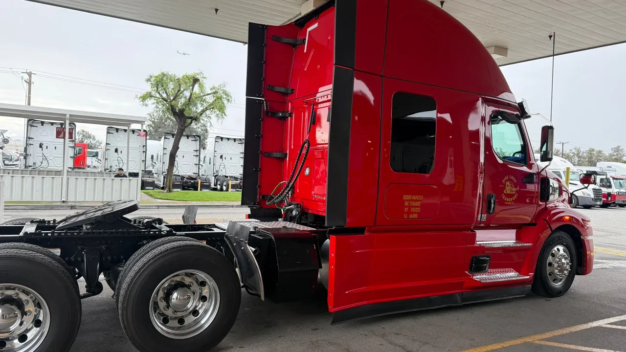 Fire Chief Transport's red Western Star, USDOT and MC numbers on the door