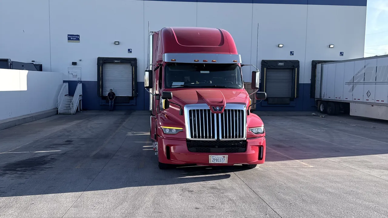 Fire Chief Transport's red Western Star at a loading dock
