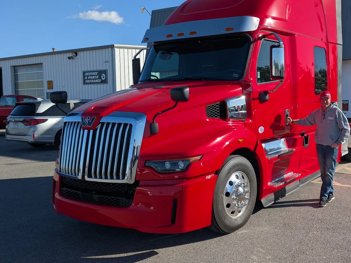 Tim Dunfee with his red Western Star at the dealership