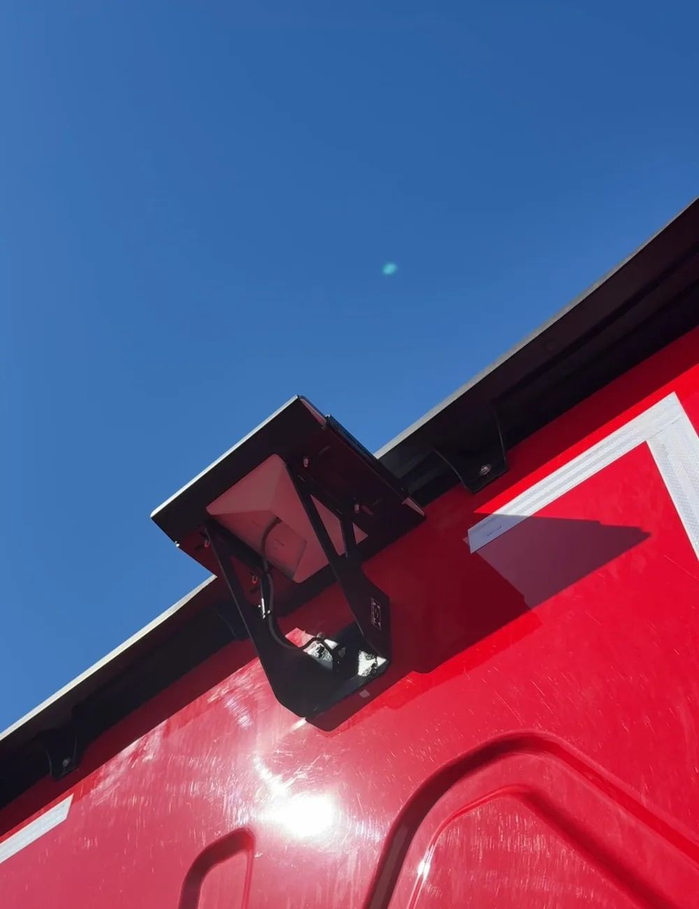 Roof-mounted Starlink dome and comms antennas on the truck