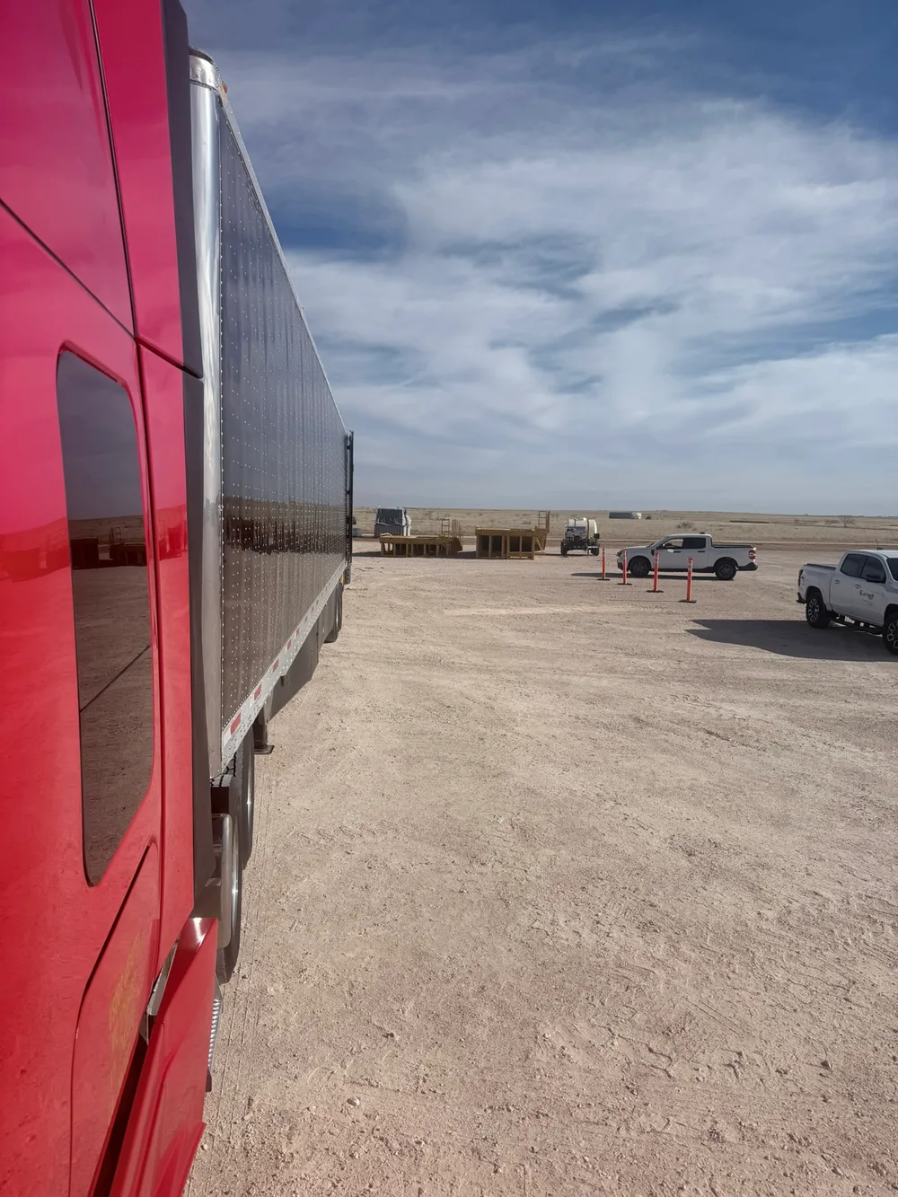 Red truck coupled to a 53-ft dry van at a lot